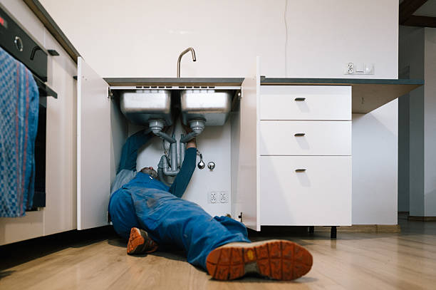 Professional Emergency Plumber technician working in New Town, MA